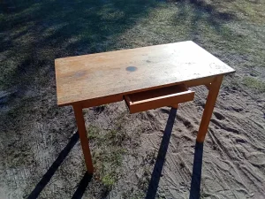 Solid wood desk with a spacious work surface and single center drawer for storage. Ideal for a home office, student desk, writing table, or craft workspace. Sturdy construction, gently used. 💲 $35 donation requested