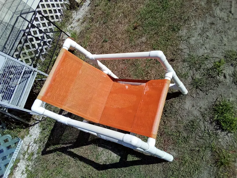 Lightweight patio chair with a sturdy PVC frame and breathable orange mesh sling seat. Comfortable, weather-friendly, and easy to move—ideal for patios, porches, pool areas, or outdoor seating. Gently used. Sold individually. 💲 $25 donation requested (each)